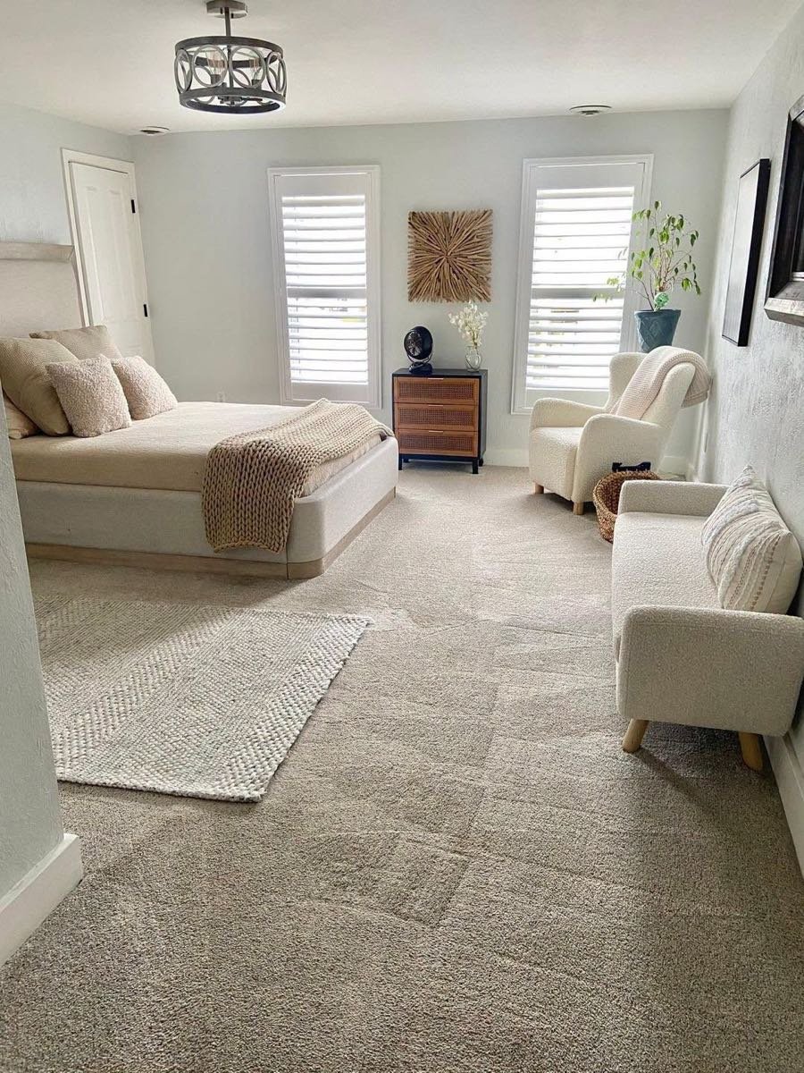 Bright bedroom with freshly vacuumed carpet